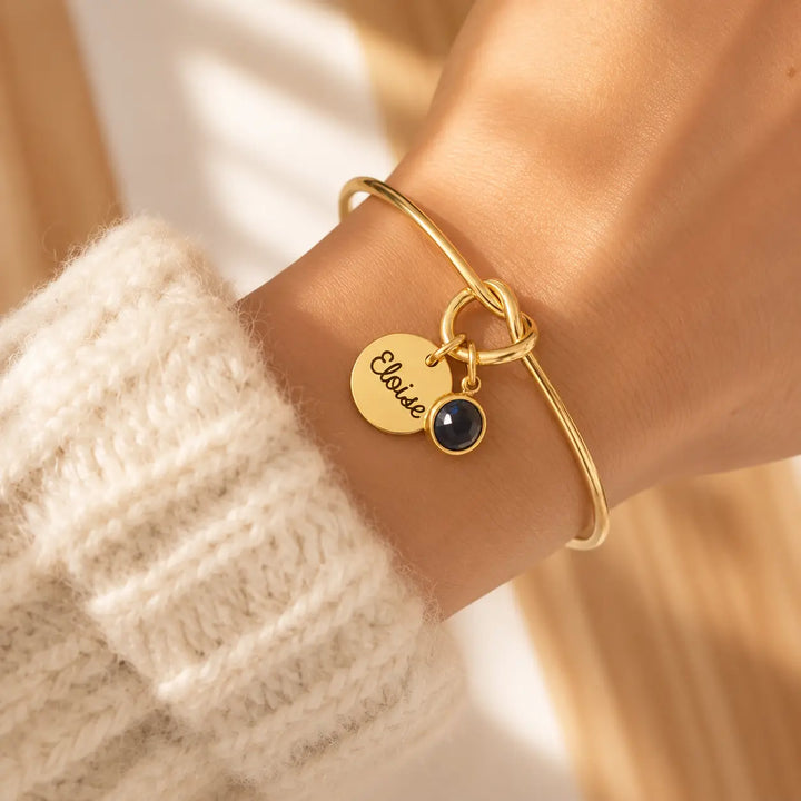 Bracelet jonc noeud doré avec pierre de naissance bleu